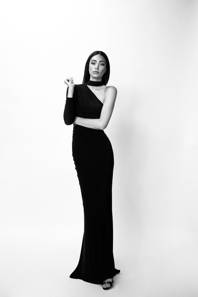 Black-and-white studio photograph of Dubravka Švegar in a long black one-shoulder gown
